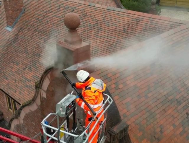 Pressure washing roof